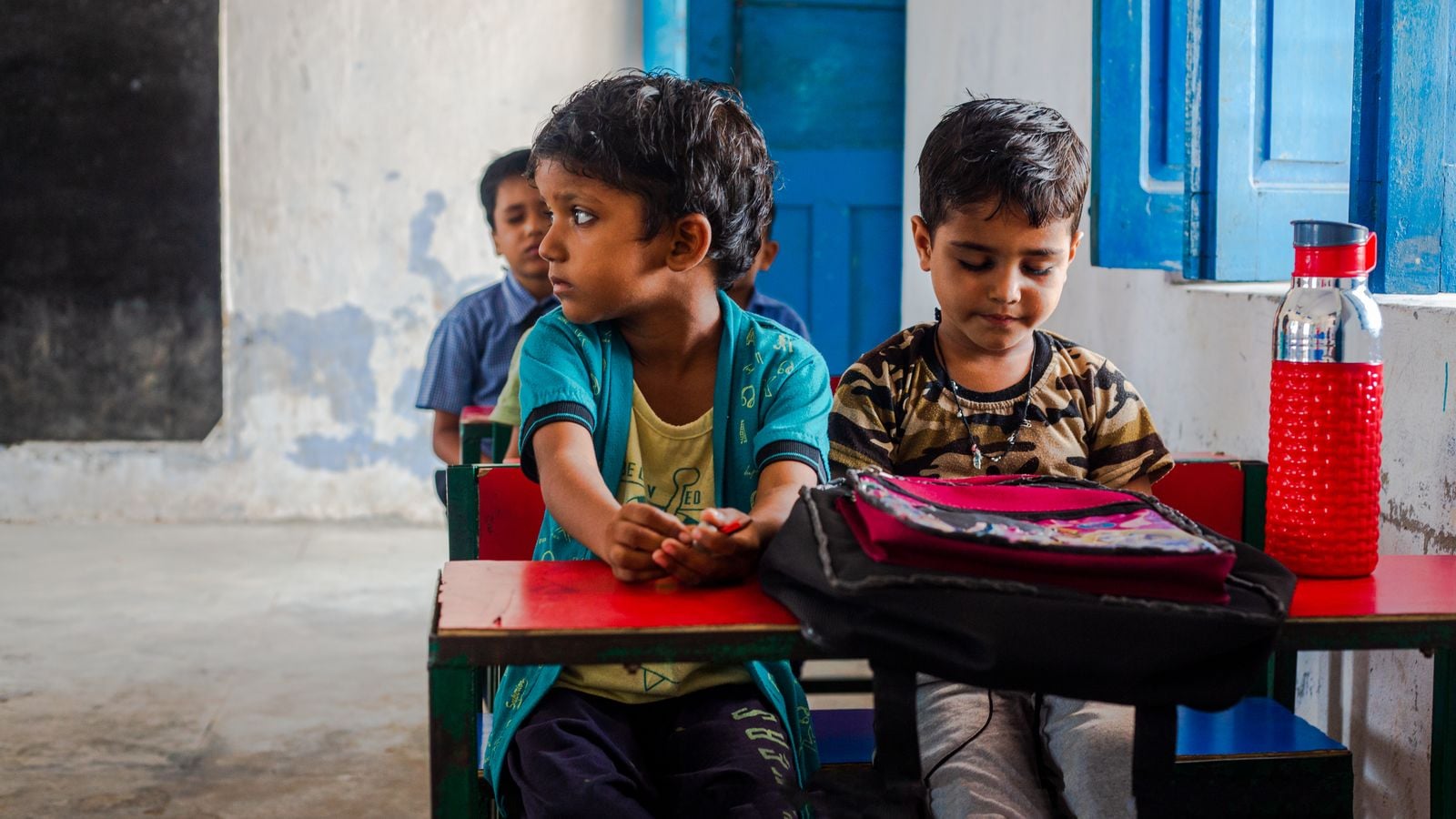 Children sitting at desks during a lesson in an Indian classroom