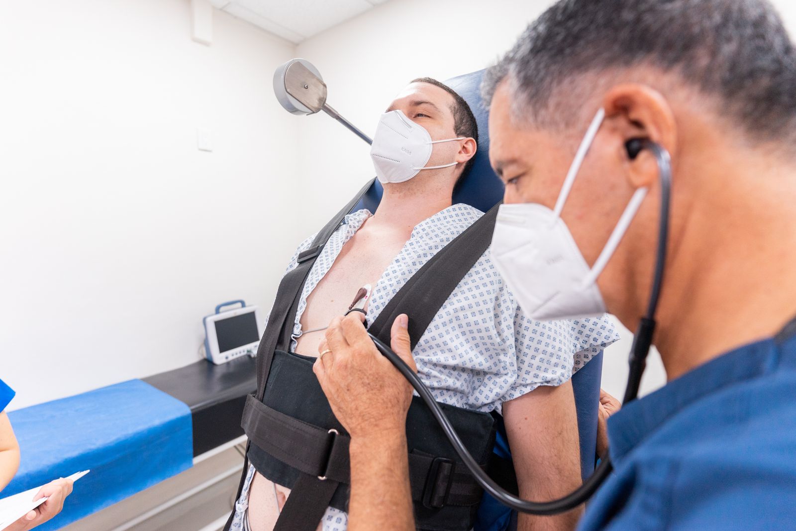 A doctor using a stethoscope during a patient examination