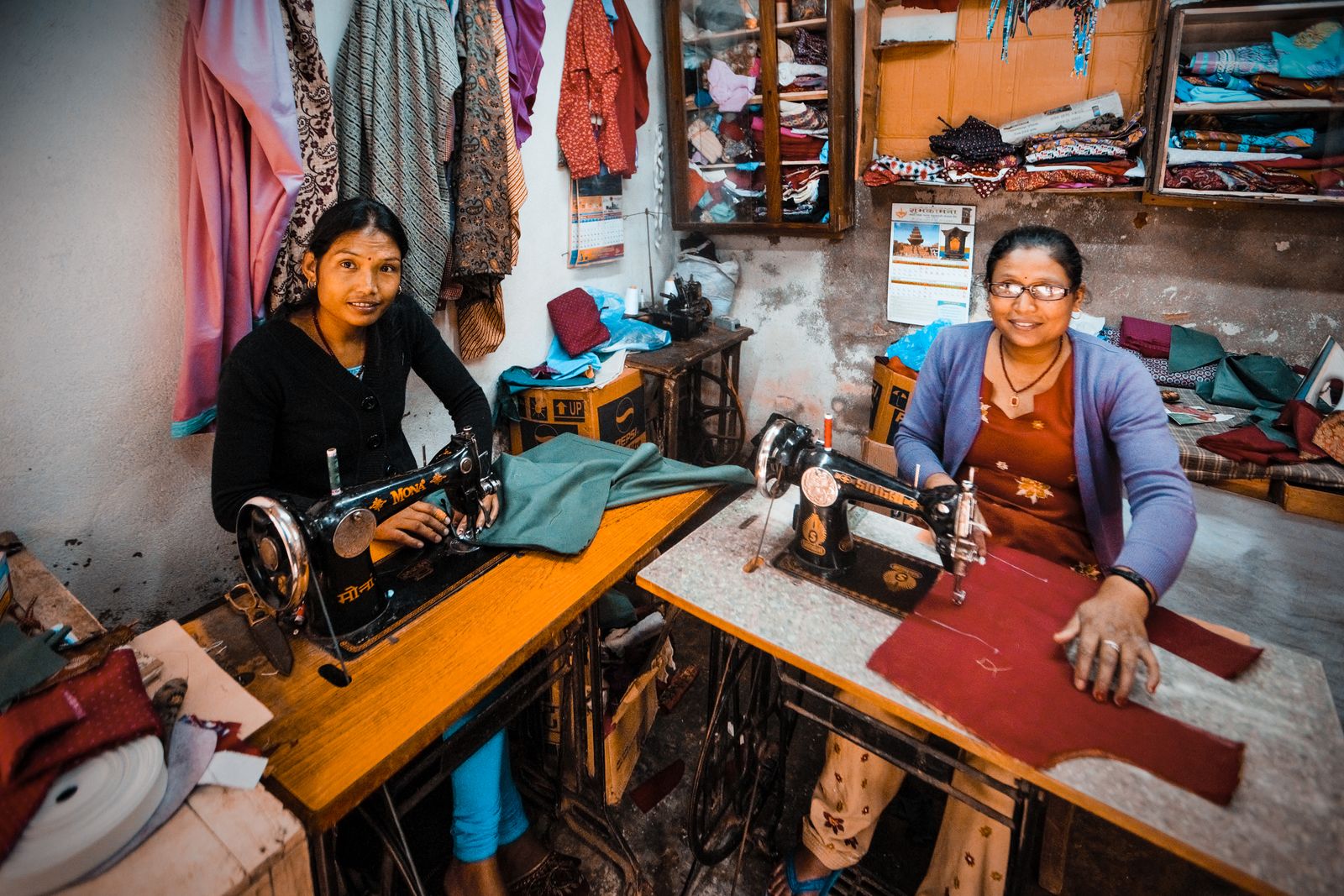 Women working with sewing machines in an Indian dressmaking workshop